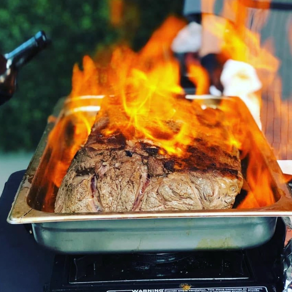 Flame-seared beef prepared at Knife and Stone in Newnan, Georgia